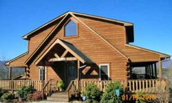--WOW!A 4/3 with panoramic mountain views will be the first thing you see as you drive in the driveway and enter the front door of this custom built log home! You will want to spend your time on the wrap around covered porch watching the sunrises and