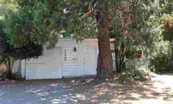 Fixer, one level. One big bedroom with wall cracking, Living/dining combo, fireplace. Gas stove in kitchen, small garage has storage shelves. Covered pond in spacious backyard.Eric Quillinan is showing 1220 Douglas Road in Stockton, CA which has 1