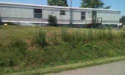 This property is located within 5 to 10 mins past the prison at Central. It has around 12 acres. There are two mobile homes + an old farm house and barn on the property. Around 8 to 9 acres are fenced. Both mobile homes are liveable. If you like to be out