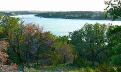 Building Site in gated community with breathtaking views of the lake. Could be purchased with adjacent lot G-13 for a total of 3.39 acres. Heavily treed. Community amenities include first-class Equestrian Center, 'Million-dollar Swimming Hole', 1100