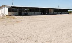 Main barn with 8 12x20 stall, a 20x20 staging area and a 12x20 tack room. Second barn has 5 12x12 stalls, 12x12 Tack room, 12x12 medicine room.12x50 covered hay storage and 30' trailer storage. It has 4 pens 50'x150' 2 pens 35'x75' 1 pen 60'x90' All with
