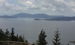 Breath taking Bay and Island views from this building site. Don't miss out on this rare opportunity. 1/2 acre property in a gated community. Located in the middle of million dollar homes. Located minutes from Fairhaven and all its amenities. Call today