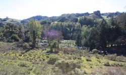 Gorgeous 4.68 +/- acre rolling parcel with wonderful views of the surrounding tree studded hills knolls and vineyards. Quiet and private, this is a wonderful place to build your vacation or dream home. You will feel secluded, yet you are only minutes to