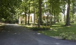 Wonderful Southern Living designed home that has been completely renovated from top to bottom. In a lovely wooded lot of Becker Quarry. More than 5000 square feet of living space with a three car garage and first floor master. Wrap around porch invites