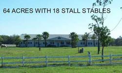 This 63.97 Acre parcel is completely fenced. At the backside of the property there is a pond & creek running through. It is part of Gamble Creek. This gorgeous parcel of land includes an 18 stall stable. The stables alone were built at a cost of 250,000