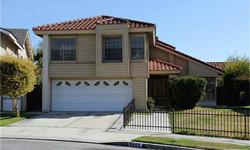 Charming Split Level Ponderosa Pool Home In Buena Park. Four Spacious Bedrooms & 2.5 Bathrooms. Inviting Living Room With Vaulted Ceilings. Formal Dining Room. Open & Bright Family Kitchen With Island, Tile Countertops & Brand New Sink. Kitchen Appliances