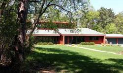 A great home on private wooded acreage with lots of amenities