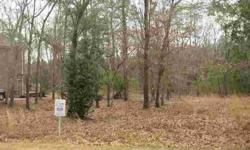 Wonderful Highland Shores building lot. Best priced lot in community, just off Hwy 133. Wooded, .29 acre lot with 30 foot boatslip included. Upscale community with pool, clubhouse, community dock and marina. Only minutes from downtown Wilmington, easy