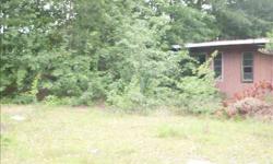 Sold as-is. Lot with possible I-26 visibility. Zoning subj. to buyer's verification. Lot has old garage on it. Ramshackle, but slab and some walls and ceiling may be good. Seller to retain easement/access to interstate grade sign. Possibly good even for a