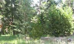 LOCATED IN BEAUTIFUL LAKE ARROWHEAD "WOODS" WITH TREE VIEW. "FLAG" LOT