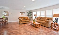 "Camp Amalfi" is a beautiful and affordable Floridian home, whose interior is reminiscent of a Southern Italian country home. Rich wood tones abound beginning with dramatic hardwood laminate flooring and sleek modern cabinetry. Adding to the interior