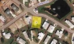 This vacant lot is a great spot for your manufactured home. Located in the popular subdivision of The Pines at Sandalhaven. Low monthly fee of $103. Clubhouse, community pool, shuffleboard courts, bocci ball court, pickle ball, and horseshoes!