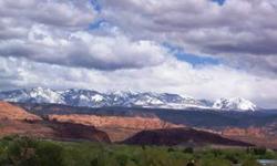is a .17 acre lot with amazing panoramic views. It is adjacent to Lot 20 and if combined would make the perfect large lot. You can't get better views anywhere else in the Moab area. This lot may have soil conditions. See official plat map.Listing