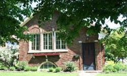 Location, Location... All Brick home in downtown Woodstock, wonderfully charming home. Home is loaded with character, arched doorways, solid original wood doors, original glass doorknobs, crown molding, fireplace, hardwood floors, full finished walkout
