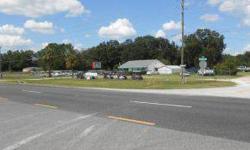 Location! Location! Close to the villages this sales lot has almost 350 ft of highway frontage.