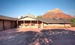 Authentic Sedona! This older remodeled home with guest casita enjoys views AND privacy on a .71 acre lot. Completely solar with electric back up means unbelievably low electric bills all year 'round. Separate 192 sq. ft. guest house. Expansive patio with