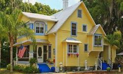 Prominently poised on the corner of Mount Dora's quaint historic neighborhood just a short walk from the village, this 1917 storybook Cape Cod cottage is one of a kind. Reflecting the style of Old Florida with a gabled tin roof and architectural accents,