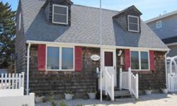 "Cozy Cape" located just 10 houses to the beach. Neat and clean inside, cedar shingles outside. 3 bedrooms, 1 1/2 baths, nice big living room with volume ceiling, back yard deck and a nice sized storage shed for bikes, boards and beach chairs. LBIs finest