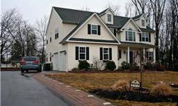 This 5 year new Colonial has it all, starting with the EP Henry hardscaped driveway and walkway. Two story entrance hall with hardwood floors and wainscoting, large living room and dining room with crown molding. Kitchen has hardwood floors, 42" cabinets,