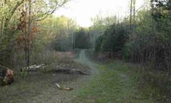 Beautiful 2.3 acres located in a peaceful and relaxing setting. Hardwoods abound and bordering a small stream. Only minutes to shopping and restaurants but very secluded and private. Unrestricted and not in a subdivision. Great building site. Driveway