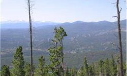 Views to thrill on this spacious 4+ acre lot in Crystal Lakes. Driveway and RV pad in, electric at road and there's cell reception too! Located at the top of Black Mountain with timber and nearby National Forest. This private site is the perfect perch for