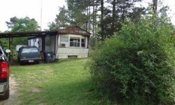 Mobilehome on six acres in Lake Hamilton School District. Great area to build on back of property and use the mobilehome for rental income. Home on propane and well water, City water at street and can be hooked into.
Listing originally posted at http
