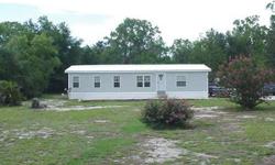 Extremely well-kept/neat-&-clean 27x52 3BR/2BA Manufactured Home, located on a partly-landscaped 0.94-acre tract, in the Waccasassa Campsites area of East Gilchrist Co. Owners have done a number of improvements inside & out, including new
