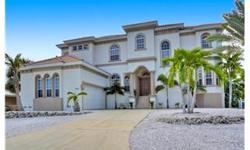 Magnificent bayfront residence overlooking a vast expanse of the Intracoastal waterway. Conveniently located only 2 miles from Florida's finest beaches, grade "A" schools, dining and entertainment. Pamper yourself, friends and family in the amazing