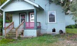 A little landscaping and a lot of cosmetic work should significantly increase the value of this 4 bedroom, 2 bath possible multi-family residence. Buyer to verify with county and city. It has all the basics and more. Make no mistake, its a fixer-upper and