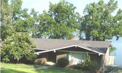 Rainbow City brick home on main channel water. Three lots w/approx.270 ft on river. Wonderful wide view of the river from rear deck or octagon shaped windows in the kit/den area. Home features 4 BR,3 full BA's,full basement, fireplace up & down, rec room