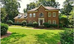 Gorgeous full brick trad home in Providence CC on large wooded yard.This home has plantation shutters, custom paint, dual staircases, 2 story foyer & guest room w full bath down.The spacious kitchen has upgraded lighting, breakfast room w built-ins & .The