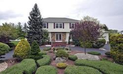 Stunning Curb Appeal On This Partial Stone Front, Custom Sided 4 Bedroom, 2 1/2 Bath Colonial In The Heart Of Manalapan Township.Circular Driveway W/Elegant Landscaping. Gorgeous Kitchen W/Custom Maple Cabinets,Granite Countertops & Tiled Backsplash.