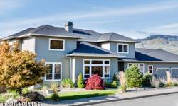Incredible five bedroom home on large fenced lot with views of Enchantments, Mission Ridge and the Columbia River. Prepare a gourmet dinner in the amazing kitchen then entertain guests on the deck or in the formal dining room. This great house has all the