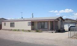 Great vacation place or a starter home with plenty parking and a garage. Lots of rooms with a big living room and additional family room. The roof was replaces just a few years ago. Close to the River, shopping, banking, Rotary Park and to public boat