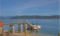 Fantastic +-100' No Bank 2.29 acre property with Deep Water Dock located just west of the Alderbrook Inn & Alderbrook Golf. The main house sets just above the bulkhead & features panoramic views of Hood Canal and the Olympics. The covered outdoor