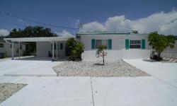 Fort Myers Beach Gulf access waterfront legal tri-plex - fully furnished - 2 bed, 2 bath main residence on left side and two 1/1 apartments on right side - Great location within walking distance to beach and grocery store. Very private view of canal lined