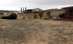 Beautiful raised view lot just right for a manufactured home. 432 N Wahweap is a .19 acre lot that has views all around. It is situated at Lake Powell Views which is a dark skies community and overlooks Lake Powell, with views of the Kapairowits Plateau