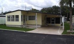 This furnished 2 bedroom/2 bath double-wide mobile home is located in the popular Spanish Trails Village. It is being sold comfortably furnished and ready for its new owners. It has two comfortable bedrooms, both with walk-in closets. And of course the