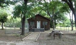 400 sq. ft. 1 bed, 1 bath cabin, utility room on back, deck on front, water well,
septic, large trees, two rock driveways, lots of wildlife, nice recreational property,
just one block from Lake Limestone, public boat ramp and marina close by
Charlie Neff,