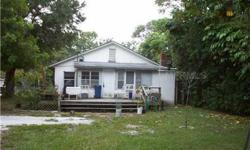 SHORT SALE. 2 BEDROOM/2 BATH CHARMER ON LARGE TREE SHADED LOT. WOOD FLOORS,SOLID WOOD INTERIOR DOORS, SPACIOUS 22 X 13 FOOT LIVING/DINING AREA. ENCLOSED PORCH ENTRY OFFERS POSSIBILITIES AS BONUS ROOM/OFFICE AREA. GAS STOVE AND SOME UPDATING IN