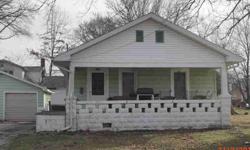 Excellent rental or make it your own ~ cheaper than renting! Quality remodeled kitchen with appliances. Hardwood floors~two bedrooms ~updated bathroom, partial basement, fenced yard. Single car detached garage. Front porch. Nice home!Listing originally