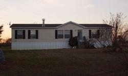 Wonderful 3BR/2BA doublewide in country! Southern Nash schools. Large Greatroom w/beautiful fireplace. Very large Eat-In Kitchen w/separate Laundry Room. Split floor plan. Master Bedroom w/Glamour Bath. Garden tub + separate shower. Located on 0.74 acres!