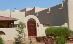 Looking for your slice of Paradise in a golf course community with magnificent views? Custom authentic Santa Fe style home w/gorgeous vigas throughout accenting the high ceilings. Huge amazing kit with granite, high end stainless steel appliances and