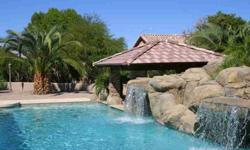 The only thing between you and PARADISE is a wonderful 4 Br home. Glimpses of waterfalls from the entrance draw you to this EXTRAORDINARY backyard, valued over $300,000! In the style of a grand vacation resort, the heated pool and spa provide a focal
