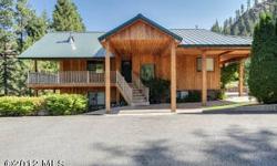 Slice of paradise on the Entiat River, over 10.3 acres of irrigated pastures, riverfront, waterfalls, deluxe horse barn, over 7 cars garages for water, snow & motor toys. Master bedroom addition overlooks the pastures and river...heavenly! Water rights