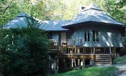 4BR home in the middle of Cashiers with the Chattooga River running right through the 7 acres, with many waterfalls. Can be subdivided.Listing originally posted at http