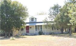 5.99 acres. Comfortable, spacious early Texas style home. Set privately back off the road. Wood floors in most of downstairs. 3/2 downstairs with large game room or guest apartment/etc. with half bath upstairs. Fenced and cross fenced with large