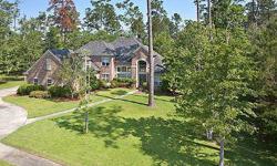 IMPECCABLE HOME LOCATED IN GATED TCHEFUNCTE TRACE SUBDIVISION FEATURING A GRAND TWO STORY FOYER WITH CURVED STAIRCASE, NEW WOOD FLOORS IN FOYER, DINING ROOM, GREAT ROOM, FLOOR TO CEILING WINDOWS IN THE GREAT ROOM OVERLOOKING THE 2.44 ACRES OF PARK LIKE