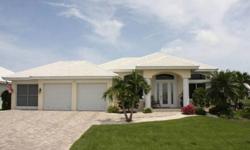 Beautiful, 3 bed/3 bath + den, waterfront home in Punta Gorda Isles w/spacious, open floor plan and sailboat access to Charlotte Harbor. Home has a large great room w/soaring ceilings and gourmet kitchen. Outside, the lanai features an 11-meter,