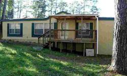 Great price for a clean Double Wide Manufactured home. Hardi Plank sides and a Composition Roof that is only 3 years old. Great home. Large porch, trees, Lake Conroe access. Must see!
Listing originally posted at http